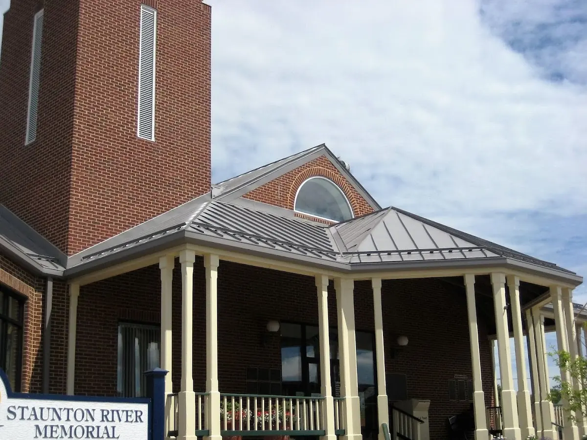 Skilled roofing craftsmen working on a residential roof in Pondsville